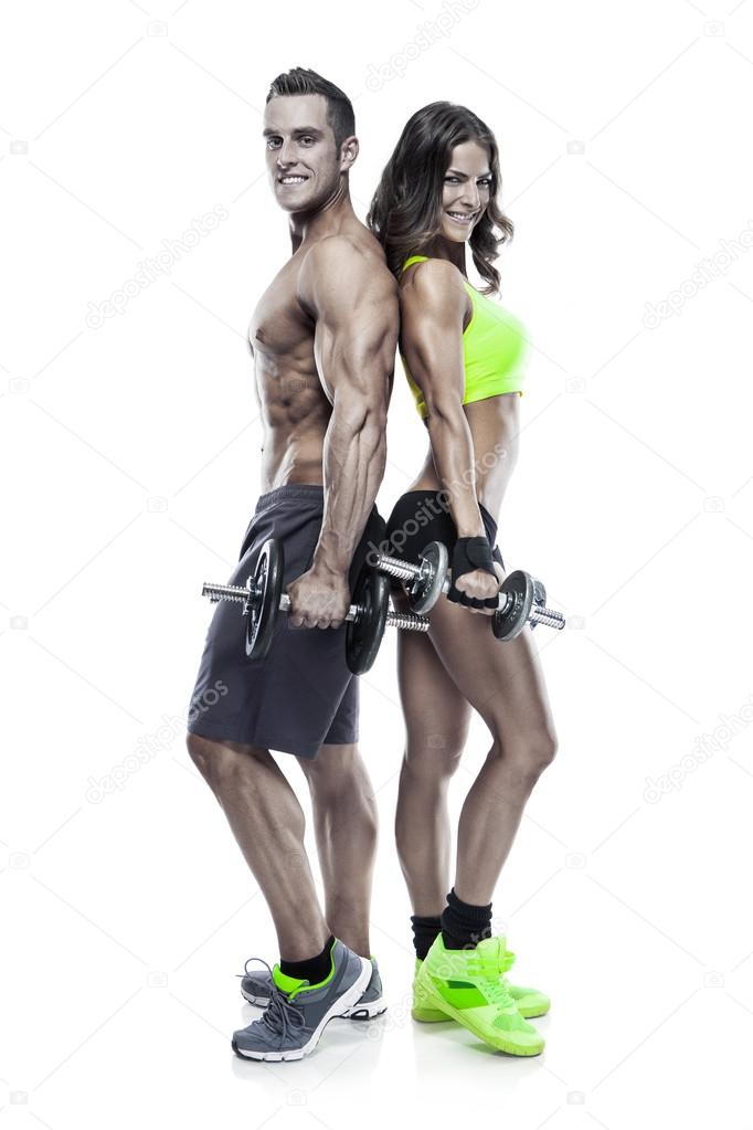 beautiful fitness young sporty couple with dumbbell