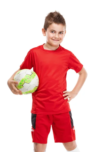 In piedi giovane giocatore di calcio in possesso di calcio — Foto Stock