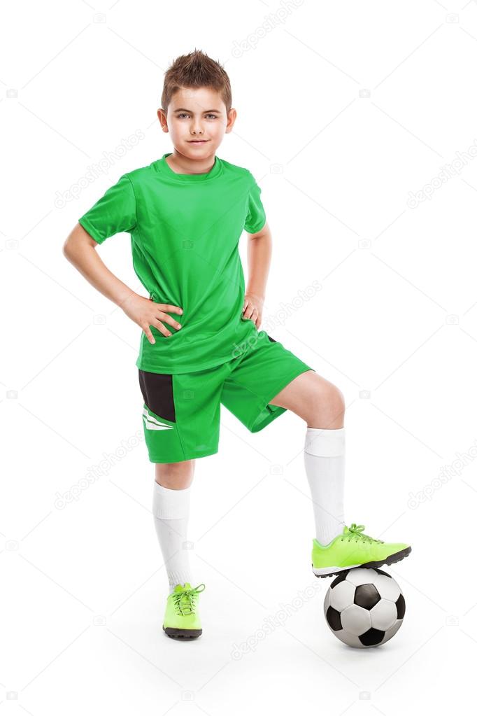 standing young soccer player with football