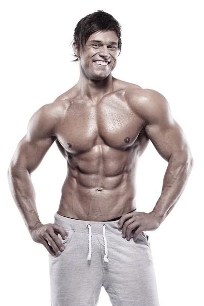 Hombre atlético fuerte mostrando cuerpo muscular — Foto de Stock