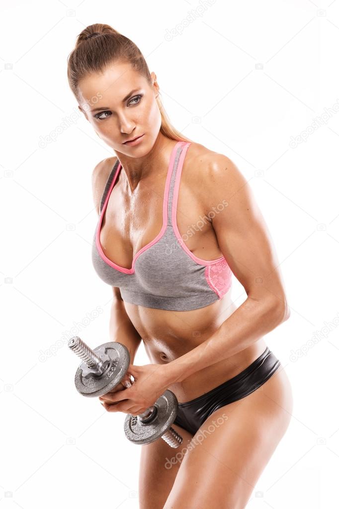 Nice sexy woman doing workout with dumbbell