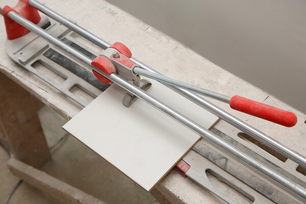 Ceramic tile cutter with tile in the house