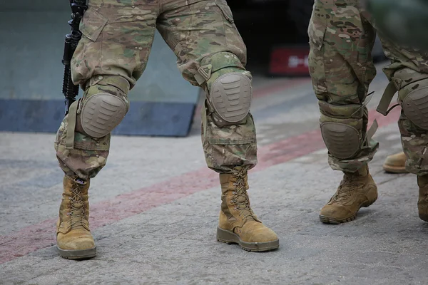 Legs of soldiers in camouflage — Stock Photo, Image