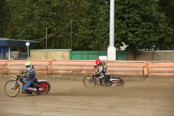 Speedway riders on the track — Stock Photo, Image