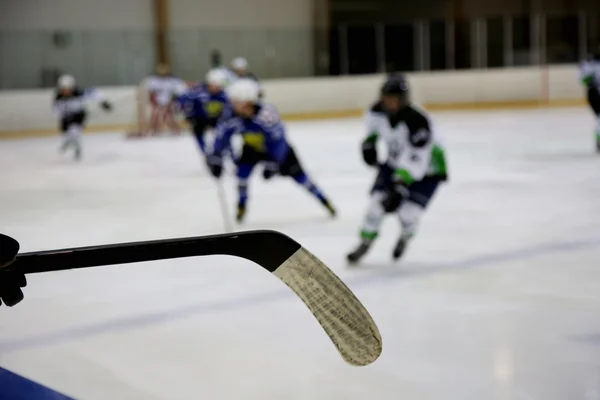 Ice-hockey stick and ice-hockey game — Stock Photo, Image