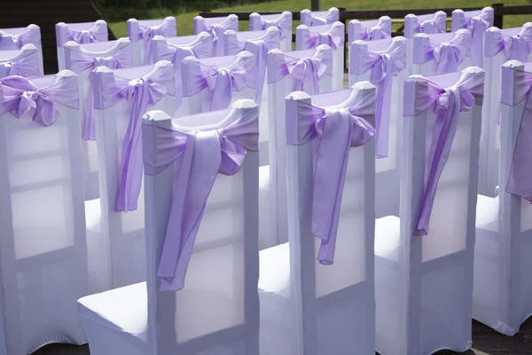 Beautiful wedding event decoration. Violet bow