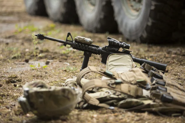 Lying tactical vest on the ground with holders — Stockfoto