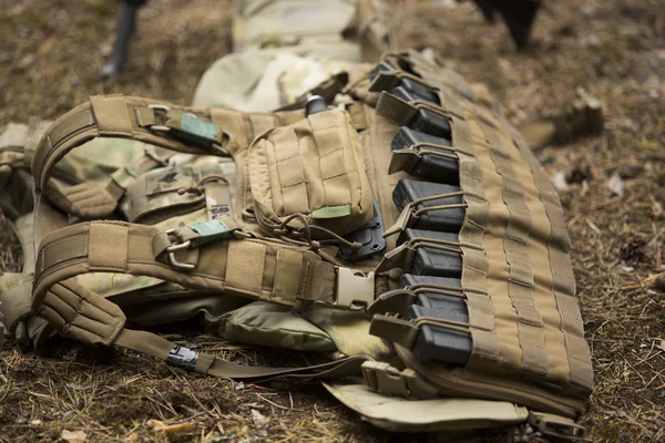 Lying tactical vest on the ground — Stock Photo, Image