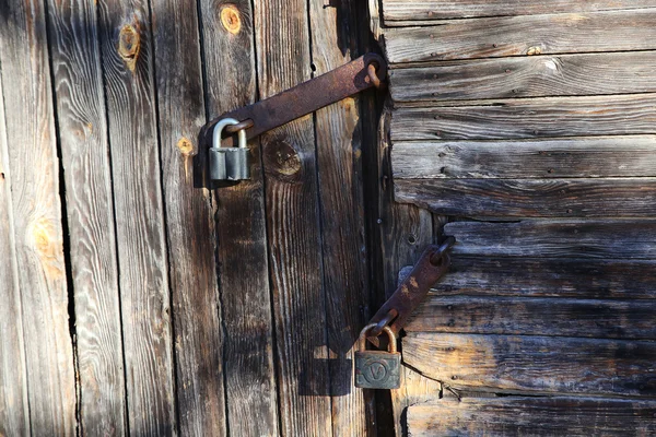 Lock on old wooden door — Stock Photo, Image