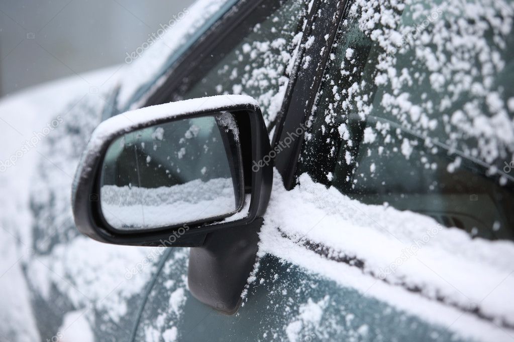 snow around car mirror