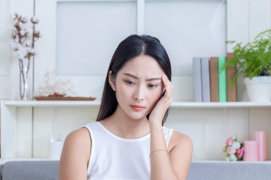 asian girl having headache 
