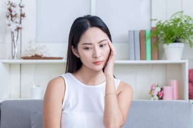 asian girl having headache 