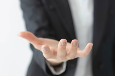 partial view of businesswoman gesturing by hand