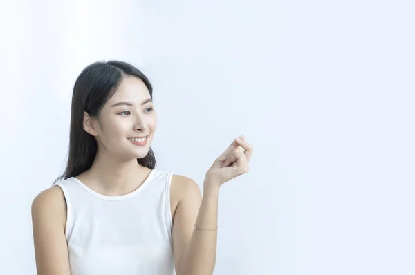 Joyful Asian Girl Gesturing Hand Advertise Concept — 图库照片