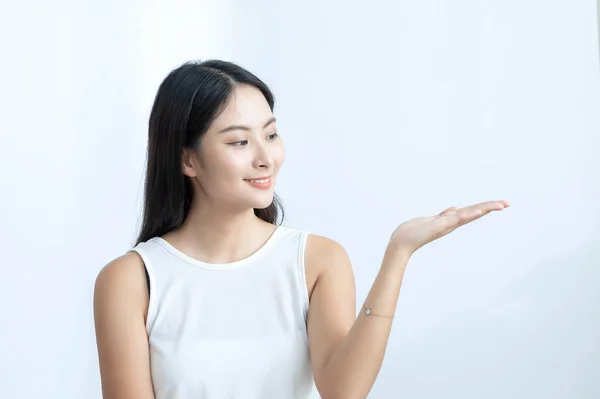 Joyful Asian Girl Gesturing Hand Advertise Concept — 图库照片