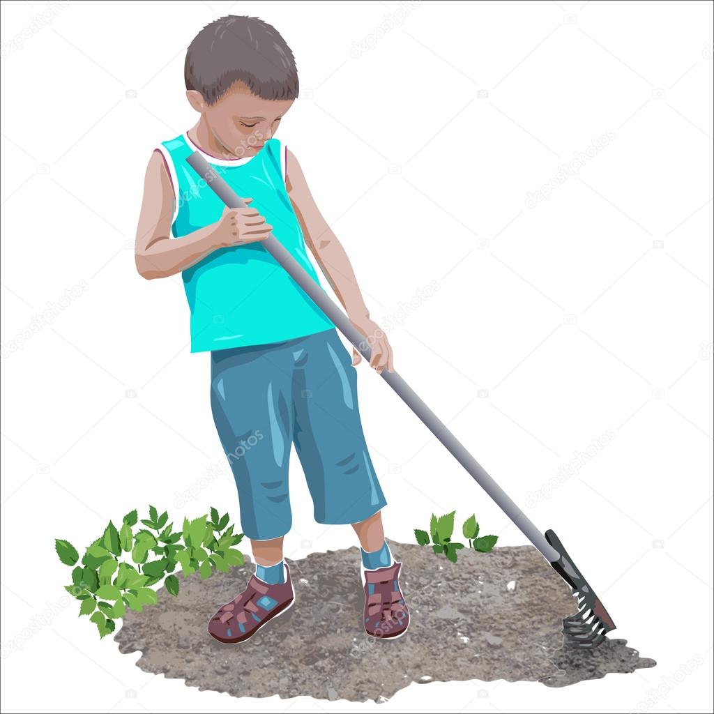 Boy raking the soil in the garden