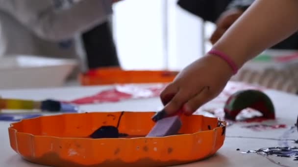 Babies Playing with Paints in Kindergarten Childcare — Stock Video