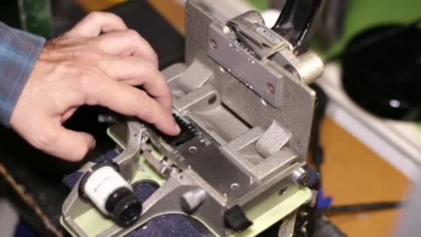 Film Technician Splicing 35mm Film — Stock Video
