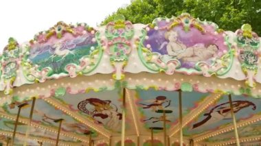 French style rotating carousel in Carcassonne. Amusement park for children. Fairground in France. Big recreation funfair for kids leisure time.