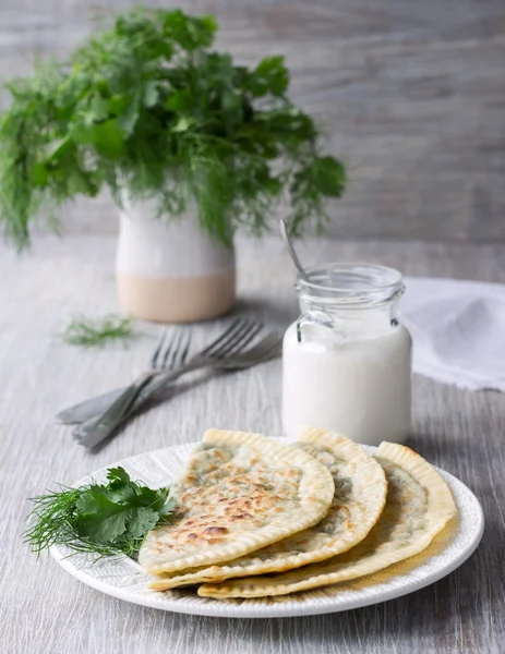 Flat bread with herbs, kutaby, traditional Azerbaijani dish