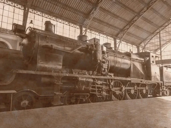 old photograph of disused train station, Madrid, Spain, aged by the patina of time,