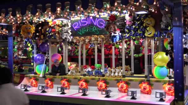 Carnival Arcade Rising Waters Game Prizes Man Awaits Patrons — Stock Video