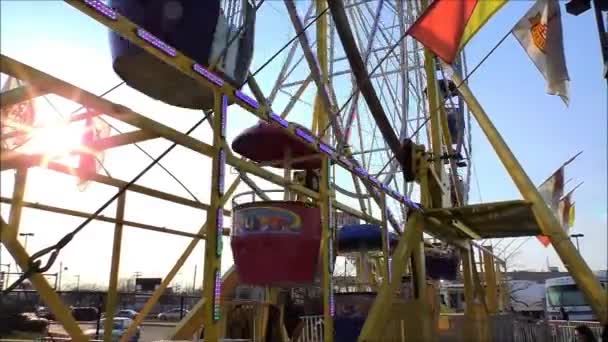 Ferris Wheel turns in sunlight — Stock Video