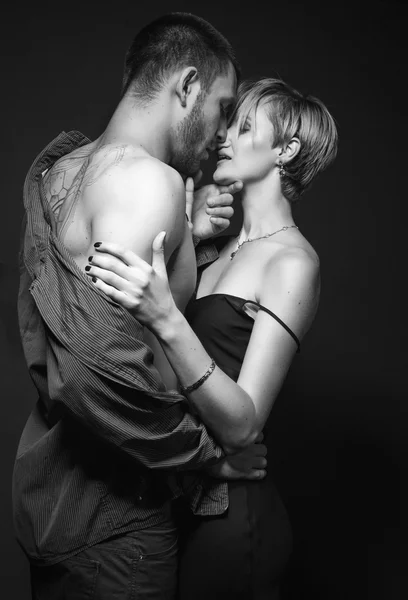 Hot and sexy young couple in love embracing and kissing. — Stock Photo, Image