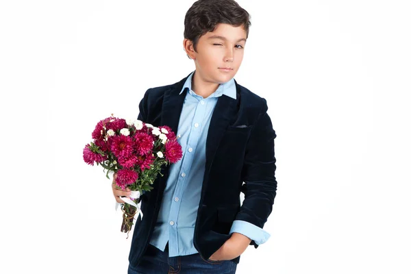 Young little boy with flowers over white background. — Stock Photo, Image