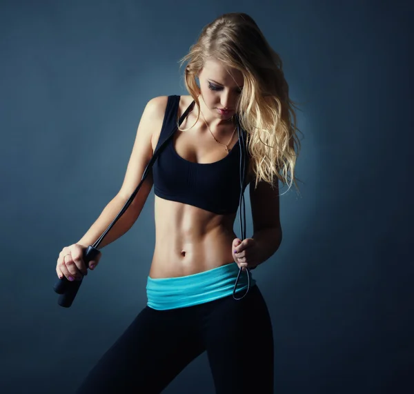 Portrait of attractive sexy fitness blond girl with jumping rope — Stock Photo, Image