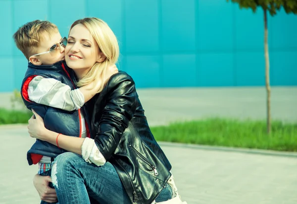 Happy family cpncept. Son kissing his beautiful mother. — Stock Photo, Image