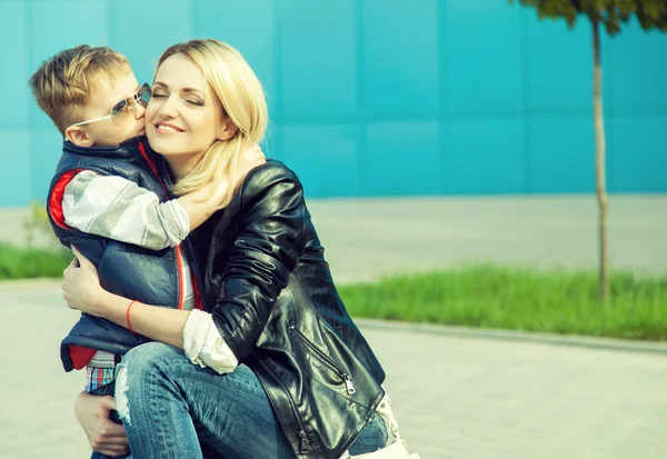 Happy family cpncept. Son kissing his beautiful mother. — Stock Photo, Image