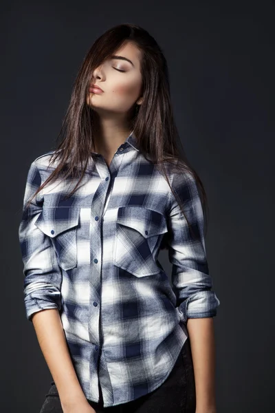 Young pretty woman in plaid shirt. — Stock Photo, Image