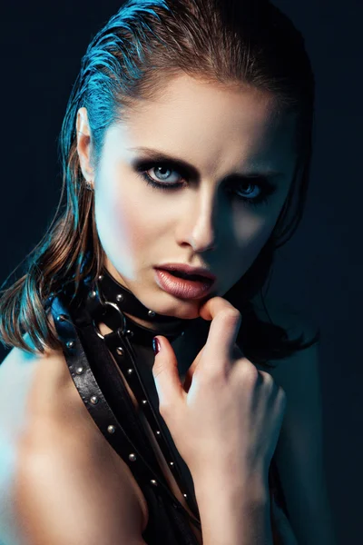 Art portrait of young woman with dark make up and leather belt o — Stock Photo, Image