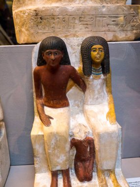 Egyptian couple with child statue. No copyright issues with this 4000 year old exhibit in the Egyptian Museum in Turin Italy.Due to its age it is classed as in the Public domain under EU law. The exhibits in this museum were acquired in Egypt in 1833 clipart