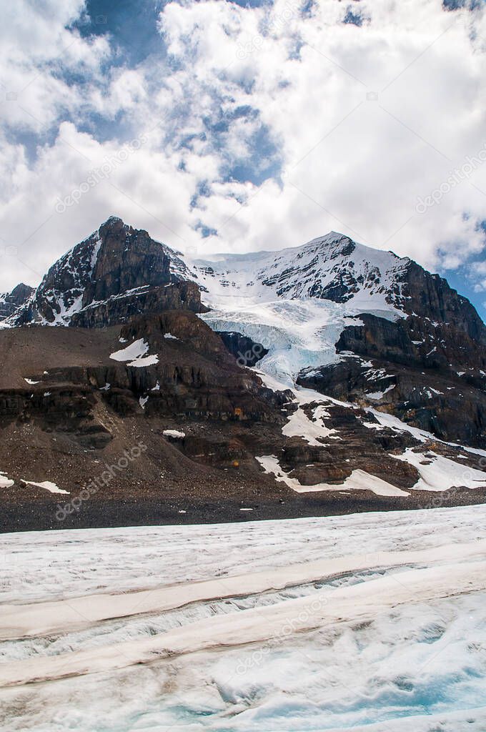 The Athabasca Glacier is one of the six principal 'toes' of the Columbia Icefield, located in the Canadian Rockies. Due to global warming, the glacier has receded more than 1.5 km in the past 125 years. 