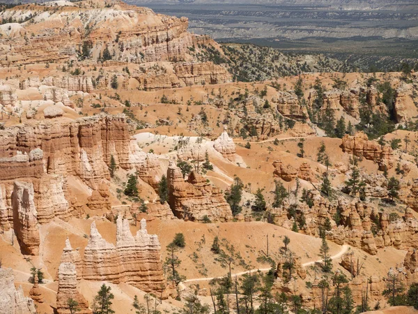 BryceCanyon is distinctive due to its geological structures, called hoodoos, formed from wind, water, and ice erosion of the river and lakebed sedimentary rocks these are eerie and often whimsical — Stock Photo, Image