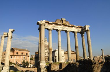 The ancient Forum with its temples and monuments is in the middle of the city of Rome Italy clipart