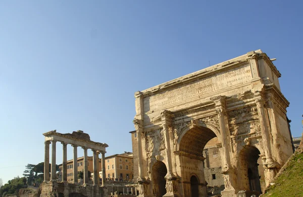 The ancient Forum with its temples and monuments is in the middle of the city of Rome — стоковое фото