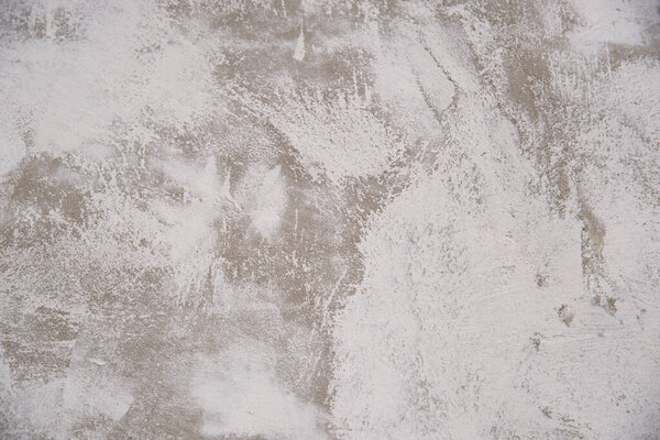 Texture of a putty concrete wall. Abstract white-gray background