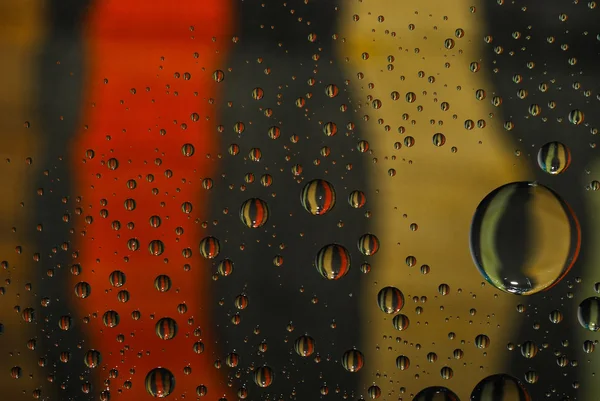 Close-up of multi-colored water droplets — Stock Photo, Image