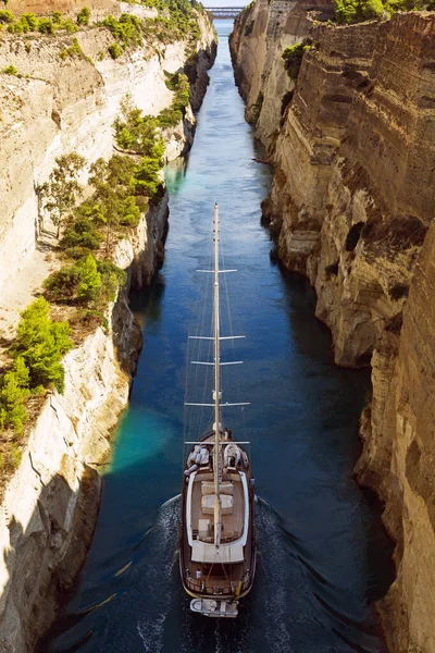 Sailing boat with crew goes through the Corinth Canal, Loutraki, Greece