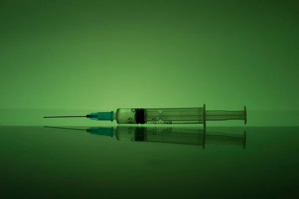 Plastic syringe with iron needle. Cure for the virus. — Stok fotoğraf