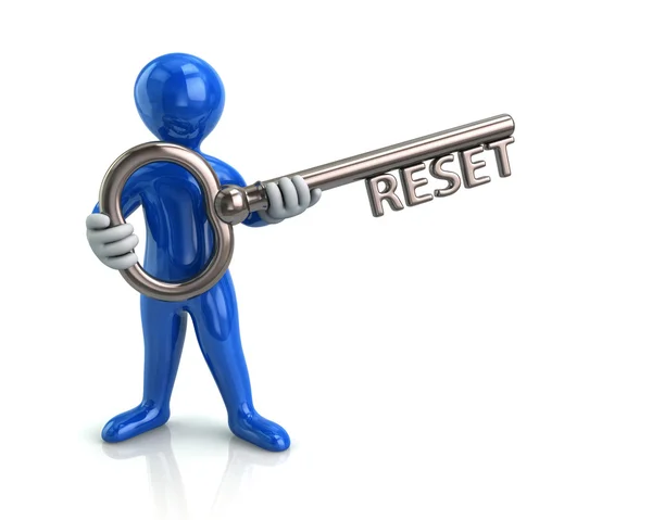 Man holding key with reset word — Stock Photo, Image