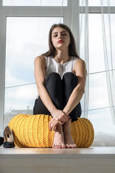 Girl resting removing shoes in the office. — Stock Photo, Image