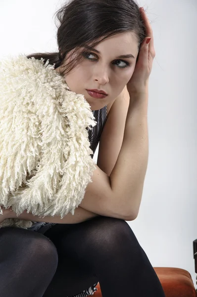 Brunette posing in the studio for a fashion catalog — Stock Fotó