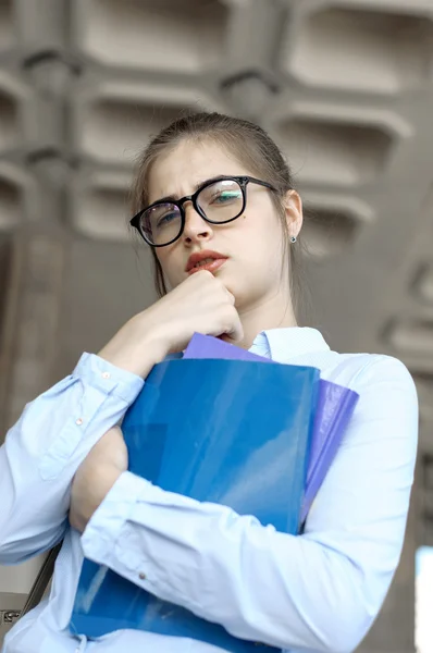 Girl student holds books — Stock Photo, Image
