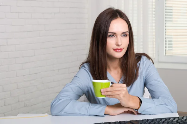 Girl drinking coffee with a calm face — Stock Photo, Image