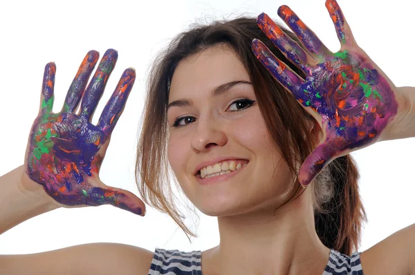 Girl shows her hands painted in colorful paint — Stock Photo, Image