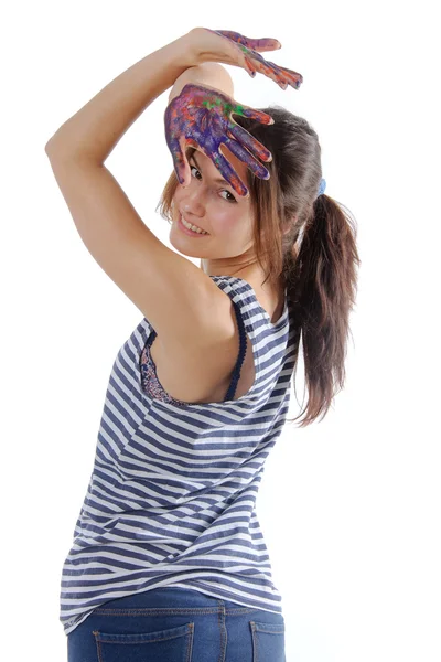 Vrouw opgetild haar handen geschilderd met verf tegen een geïsoleerde — Stockfoto